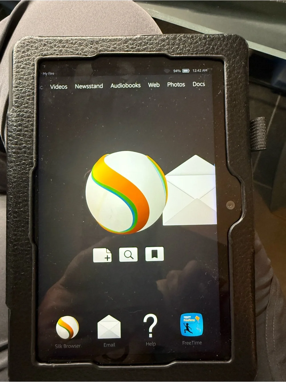 Amazon Kindle Fire tablet (generation 3) with black textured folio case